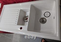 Kitchen sink with tap