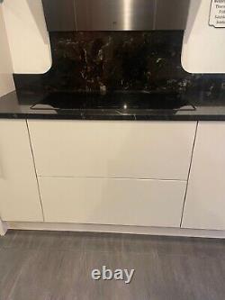 Used glossy cream kitchen, kitchen units with granite worktop and appliances